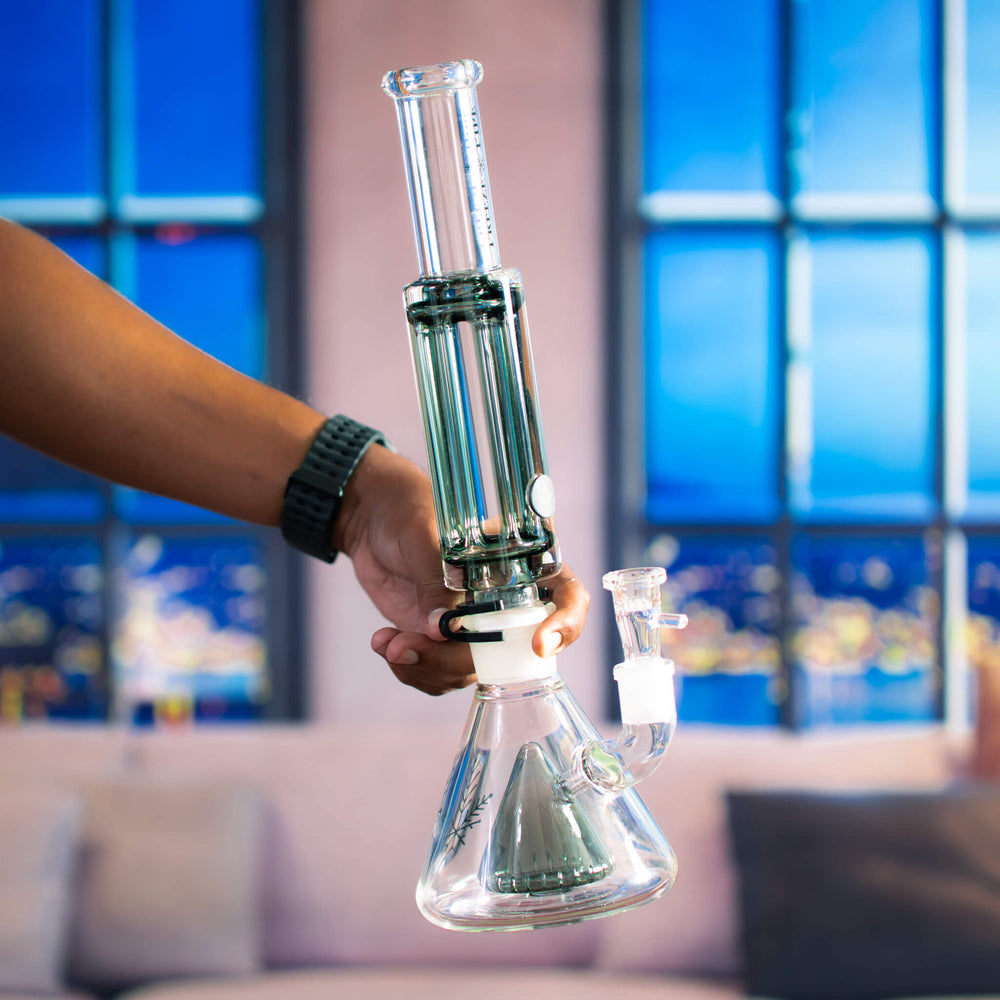 Holding a Bong Pro, showing the XL Revolver Coil and the showerhead perc in the base